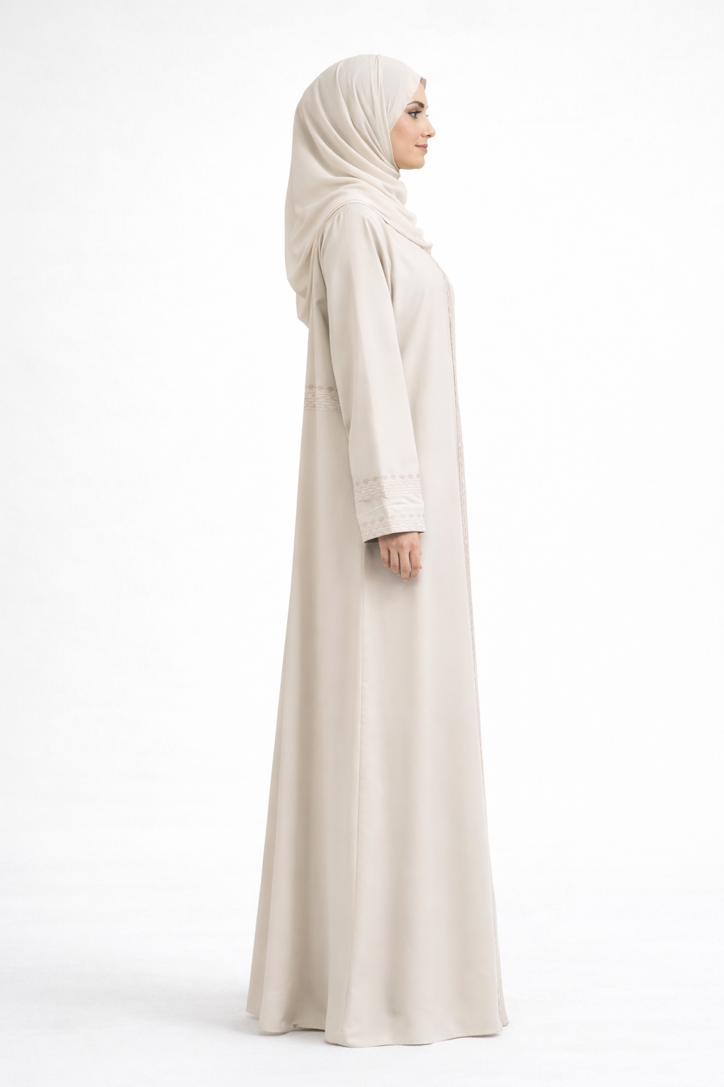 Cream Barbie & Reem style abaya with box collar and embroidered cuffs, full-length side profile view.