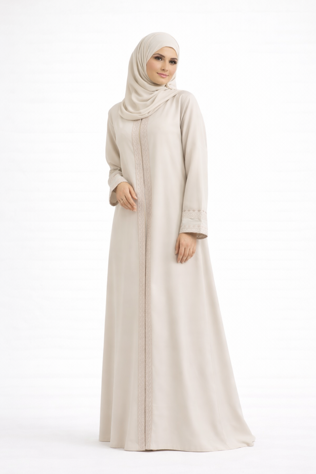 Cream Barbie & Reem style abaya with box collar and embroidered cuffs, full-length front view (relaxed stance).