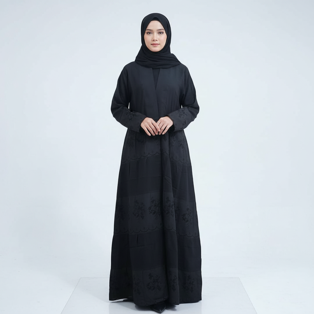 Front view on light background of black Hana layered crepe abaya with soft drape and subtle embroidery, matching black hijab.