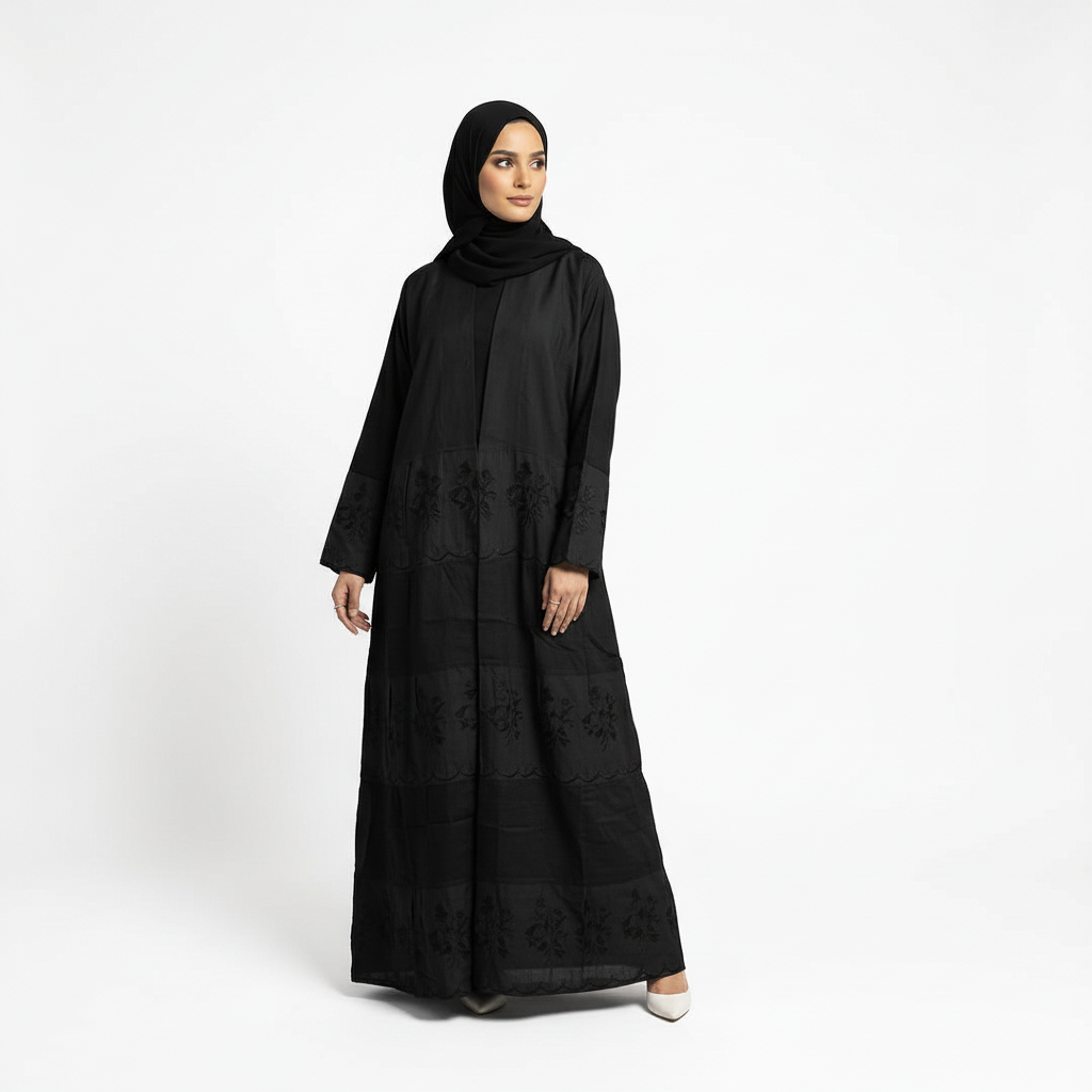 Back three-quarter view of black Hana layered crepe abaya showing length and drape, matching black hijab.