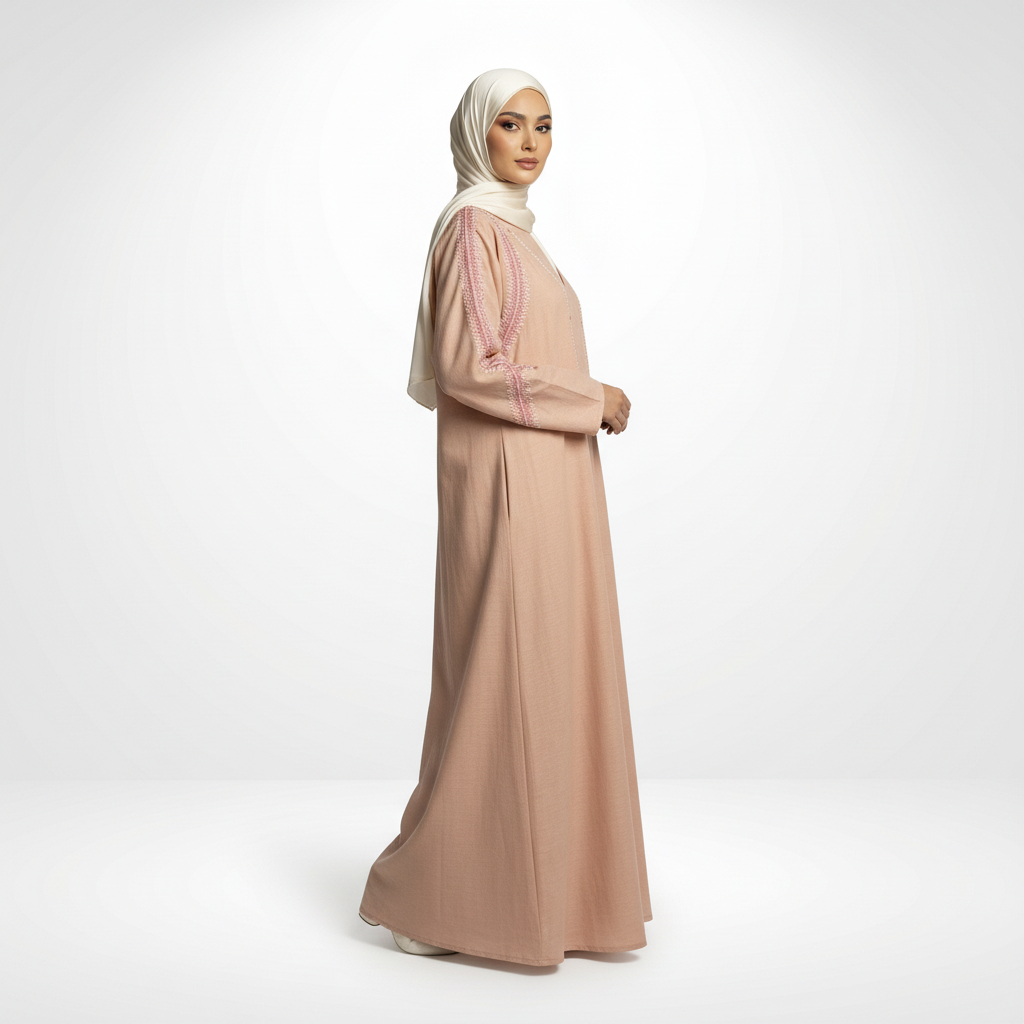Pink linen embroidered abaya with zigzag detailing, cream hijab, full-length side profile view.