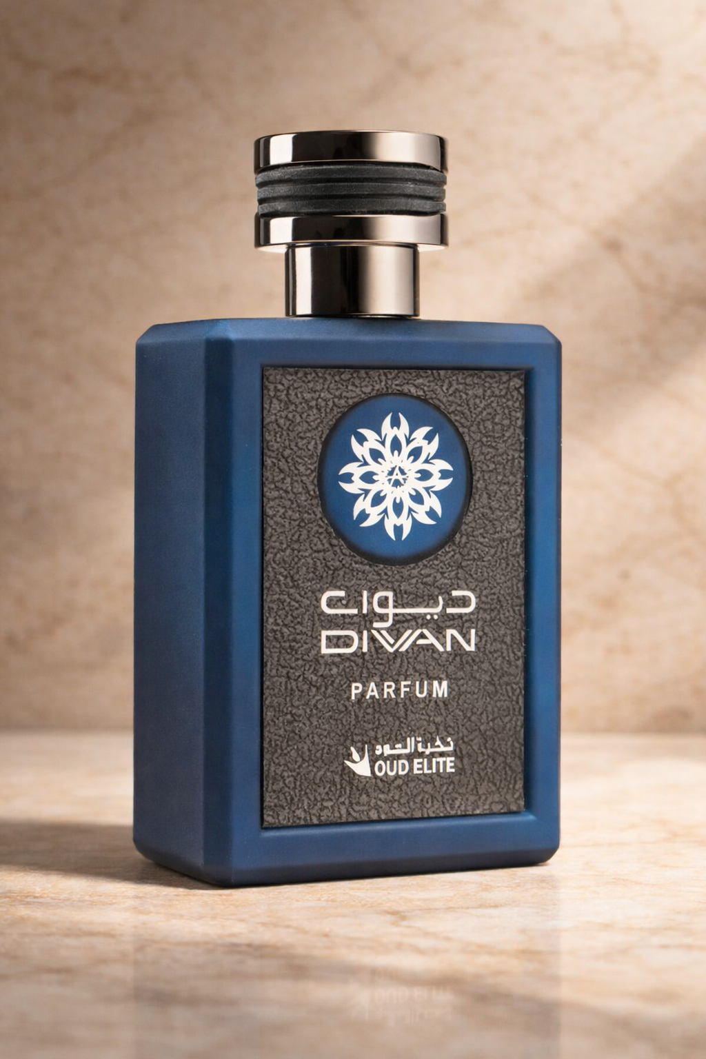 Close-up of Oud Elite Diwan perfume bottle 100ml highlighting blue glass design, cap detail and front label. MarySophora.com
