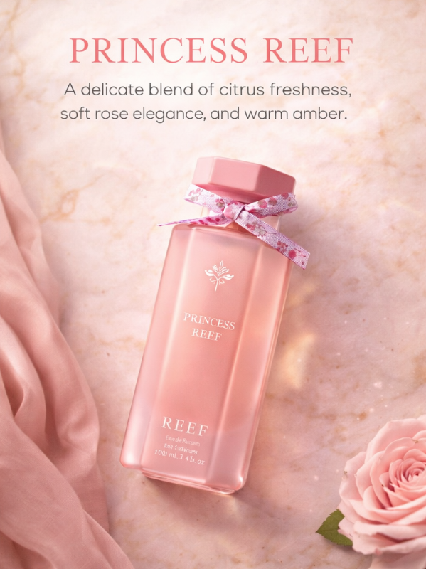 Princess Reef perfume angled on soft pink textured background with rose petals.